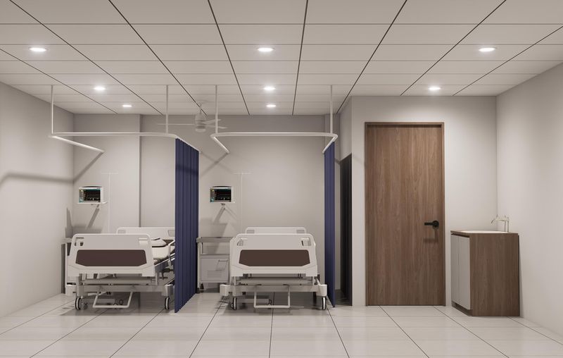 Patient care area with beds and privacy curtains